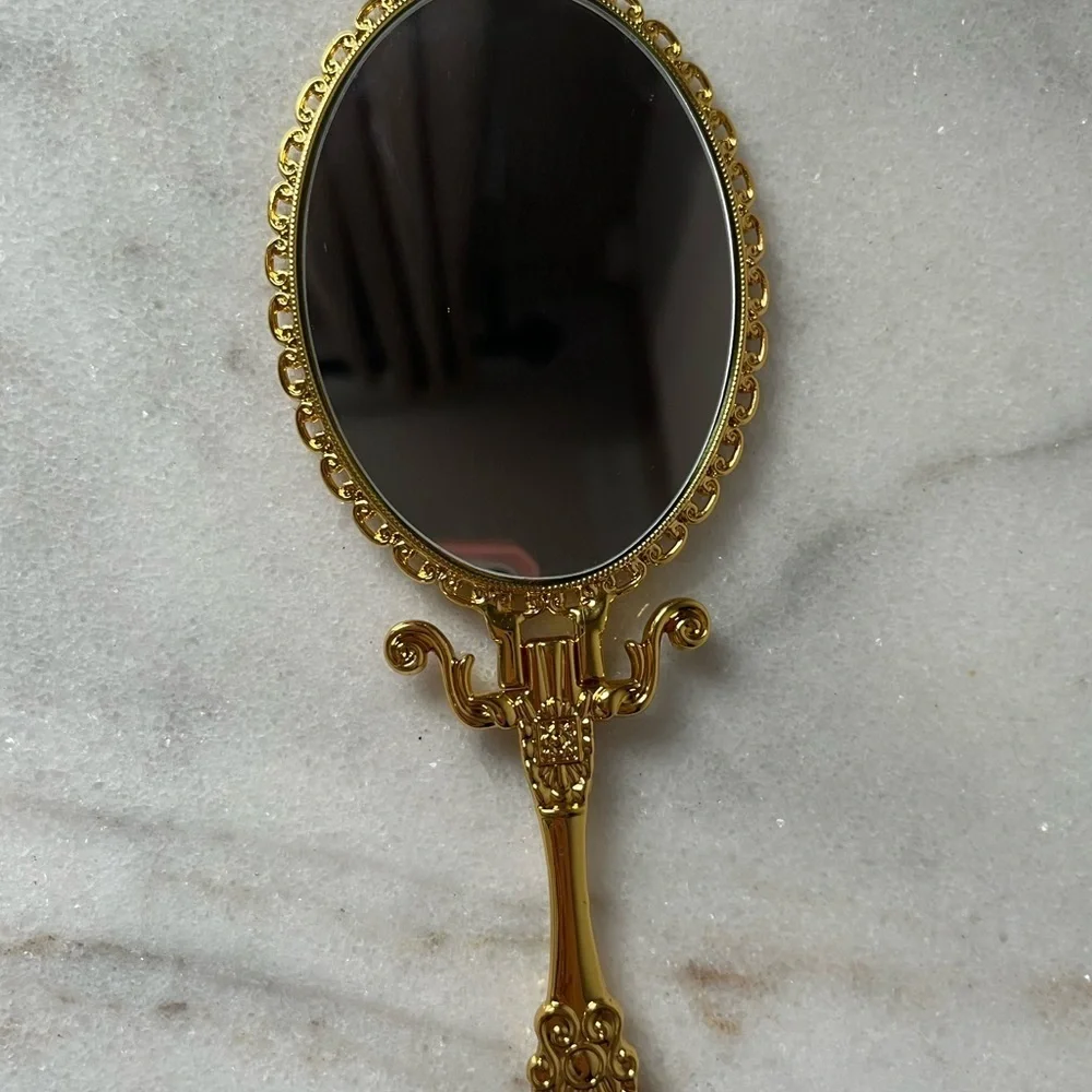Izzy and Liv gold Fold Away Hand Mirror adjustable